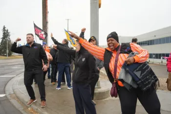 ATU members walking the line and chanting as drivers honk and show support